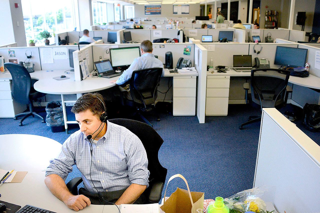 Daniel Lucente, an associate at the Denali Group in Pittsburgh, works in the company’s Strip District office. (Michael Henninger/Pittsburgh Post-Gazette)