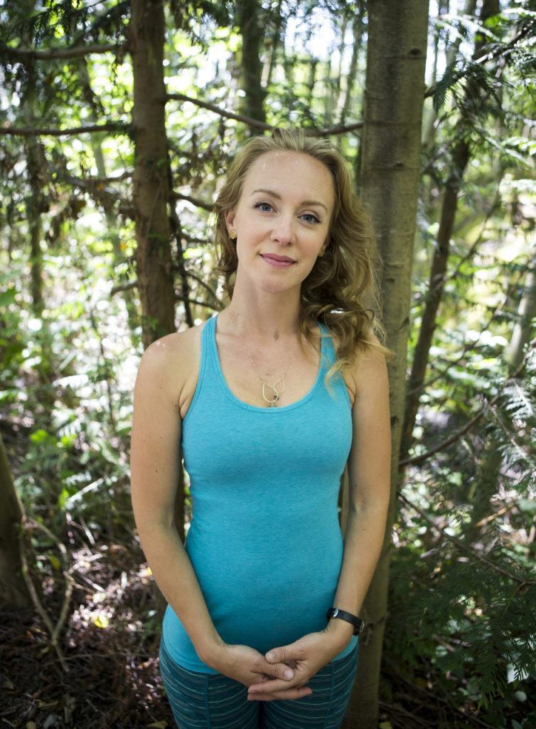 Yoga instructor Carly Hayden teaches a variety of classes including YogaMosa, a class taught at Everett’s Bluewater Organic Distilling on select Saturdays, as well as stand up paddleboard yoga. (Ian Terry / The Herald)
