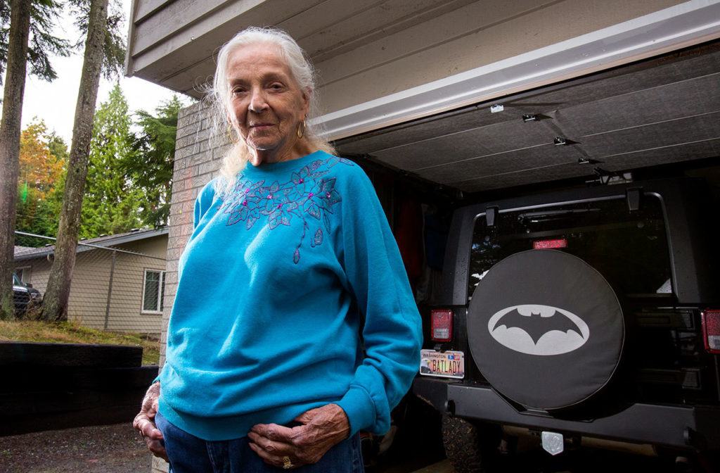 Ogaard’s black Jeep features a spare tire cover decorated with a bat silhouette and a custom license plate with her nickname. (Andy Bronson / The Herald)
