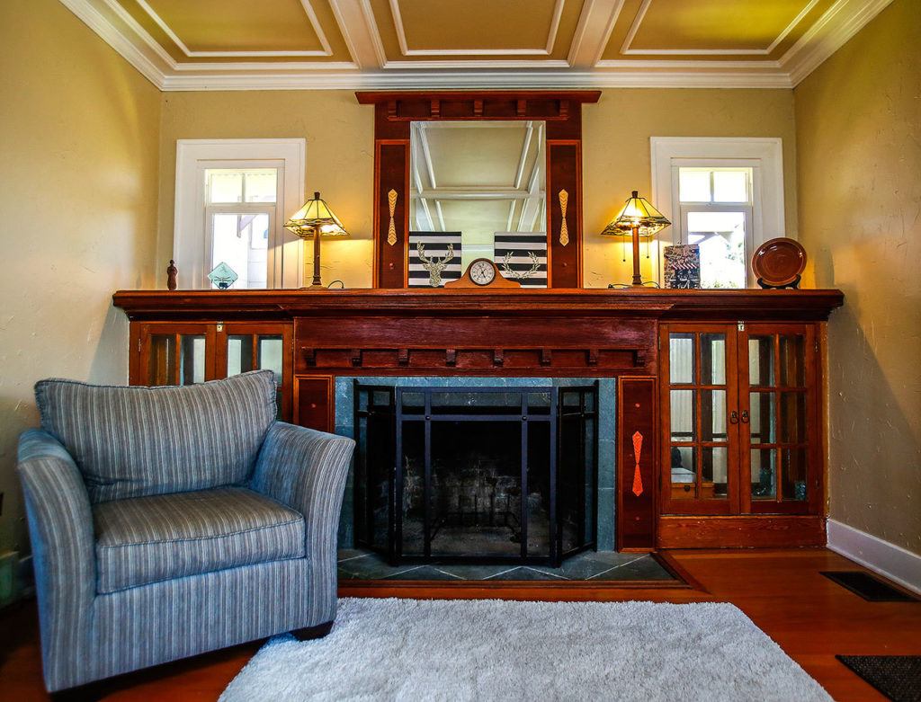 The Keenans refurbished their living room ceiling to match the Craftsman look of their fireplace. (Dan Bates / The Herald)
