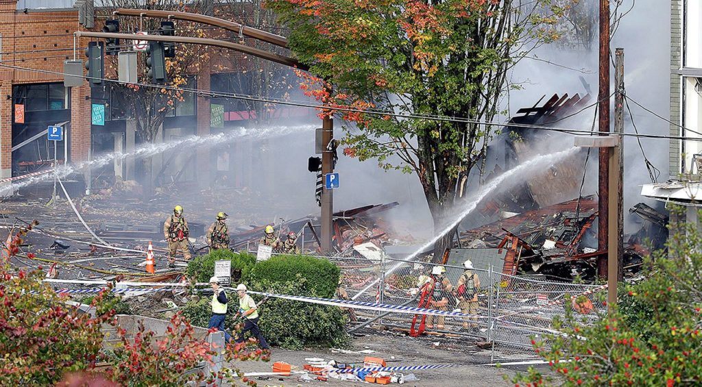Firefighters battle a blaze after a gas explosion in Portland, Oregon, on Wednesday. (AP Photo/Don Ryan)
