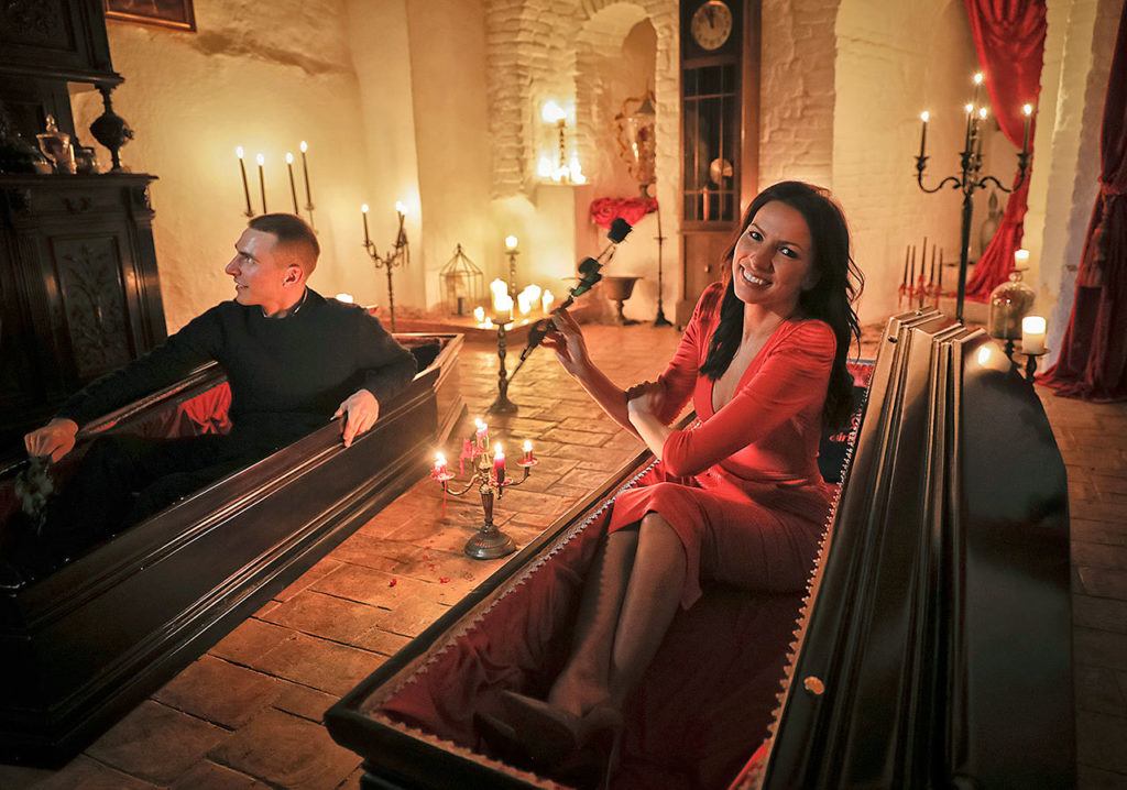 Tami Varma and her brother Robin pose in coffins at Bran Castle, in Bran, Romania, on Monday, Oct. 31. (AP Photo/Vadim Ghirda)
