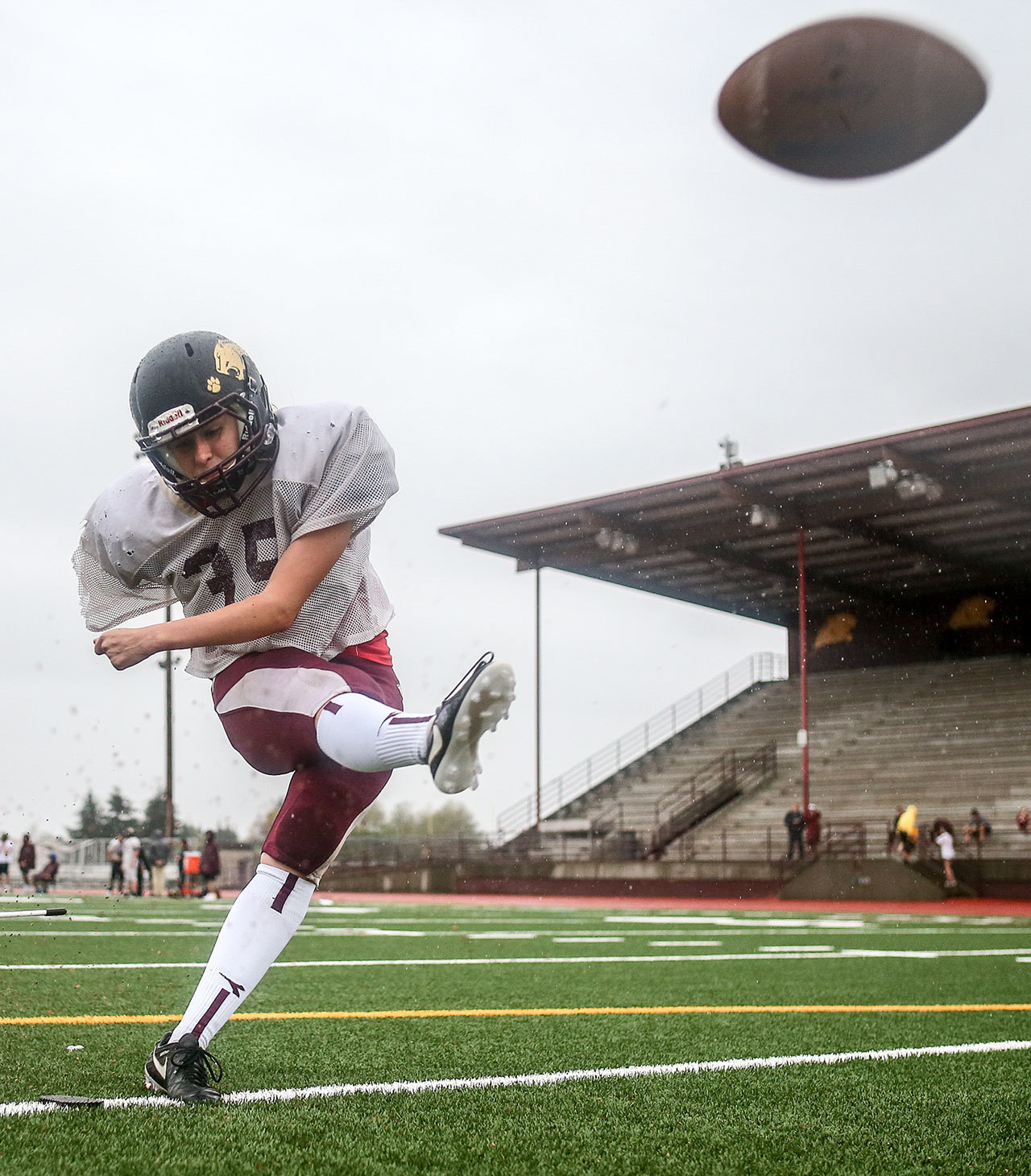 Lakewood’s Sydney Gormley works on her place-kicking form in practice on Thursday in Arlington. Gormley had anoutstanding all-around evening during the Cougars’ homecoming win. (Kevin Clark / The Herald)
