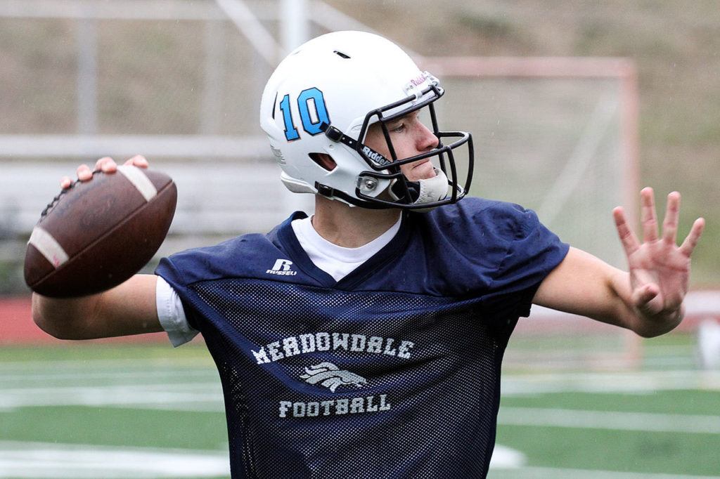 Meadowdale quarterback Drew Tingstad winds up for a pass during practice Thursday afternoon at Meadowdale High School in Lynnwood. (Kevin Clark / The Herald)
