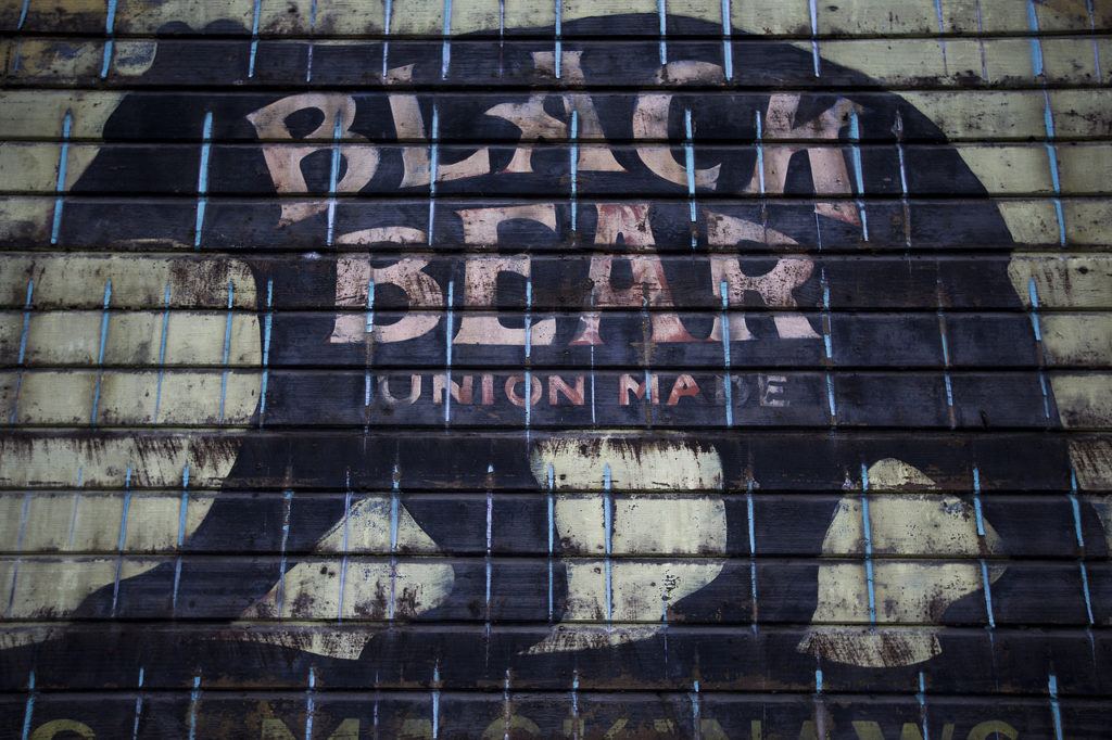 A late 19th century building in downtown Sultan bears the mark of an old clothing company for loggers and craftsmen. The sign was discovered by Jim and Michelle Tinney who plan to open Kiss The Sky, a coffee shop and book store, in the building this coming spring. (Ian Terry / The Herald)
