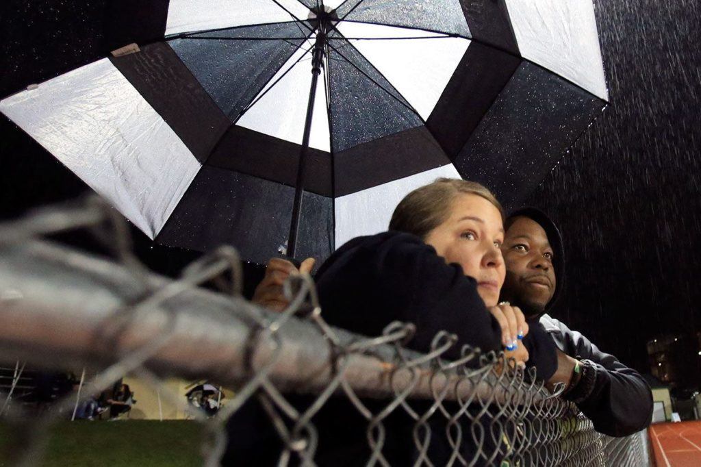 Sabrie and Steve Taylor watch their daughters, Oshinaye and Veronika Taylor, play soccer for Marysville Getchell High School. (Kevin Clark / The Herald)
