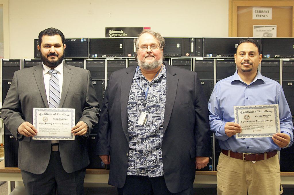 Edmonds Community College student Faraj Alqahtani (from left), Computer Information Systems instructor Steve Hailey, and student Ahmad AlMegren celebrate the students’ CyberSecurity Forensic Analyst certification. (Edmonds Community College photo)
