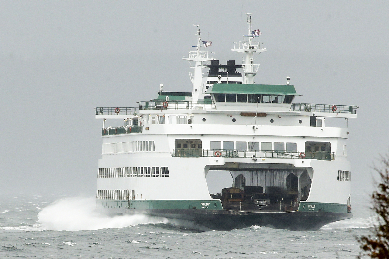 A Washington State ferry makes its way through waves to Edmonds on Friday, Oct. 14. High winds put the Edmonds-Kingston ferry behind schedule on Friday afternoon. (Ian Terry / The Herald)
