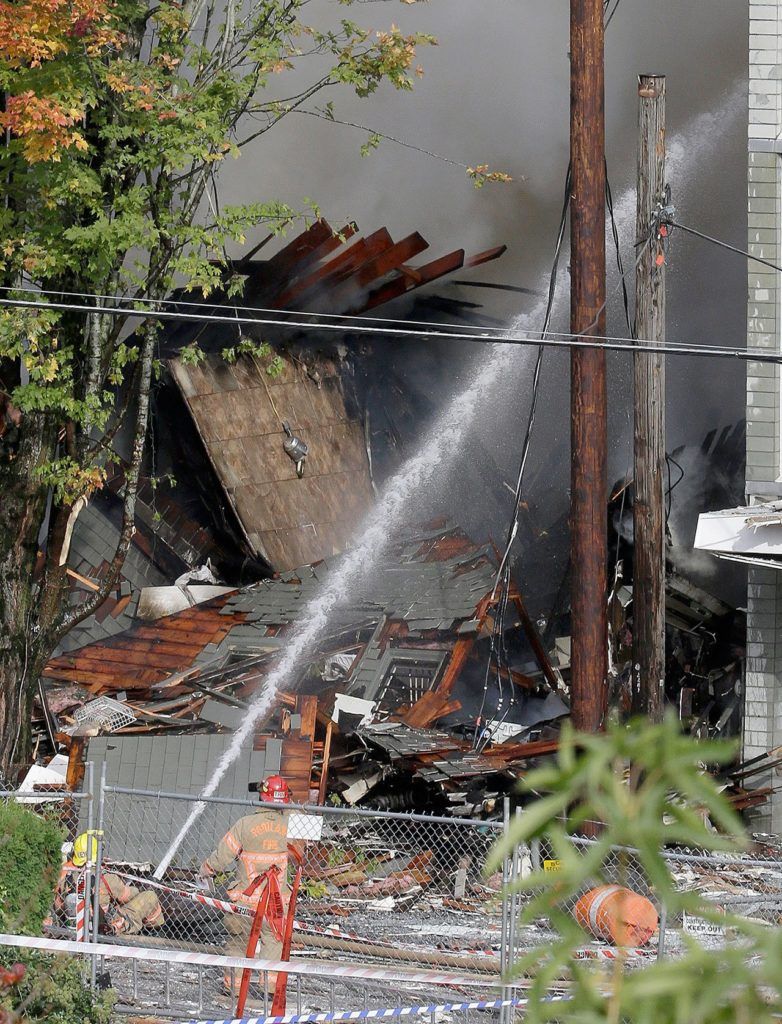Firefighters battle a blaze after a gas explosion in Portland, Oregon, on Wednesday. (AP Photo/Don Ryan)
