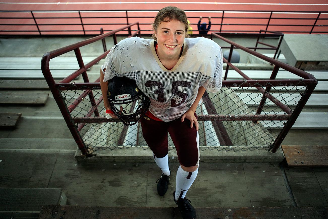 She kicks, tackles and plays in the band for Lakewood High