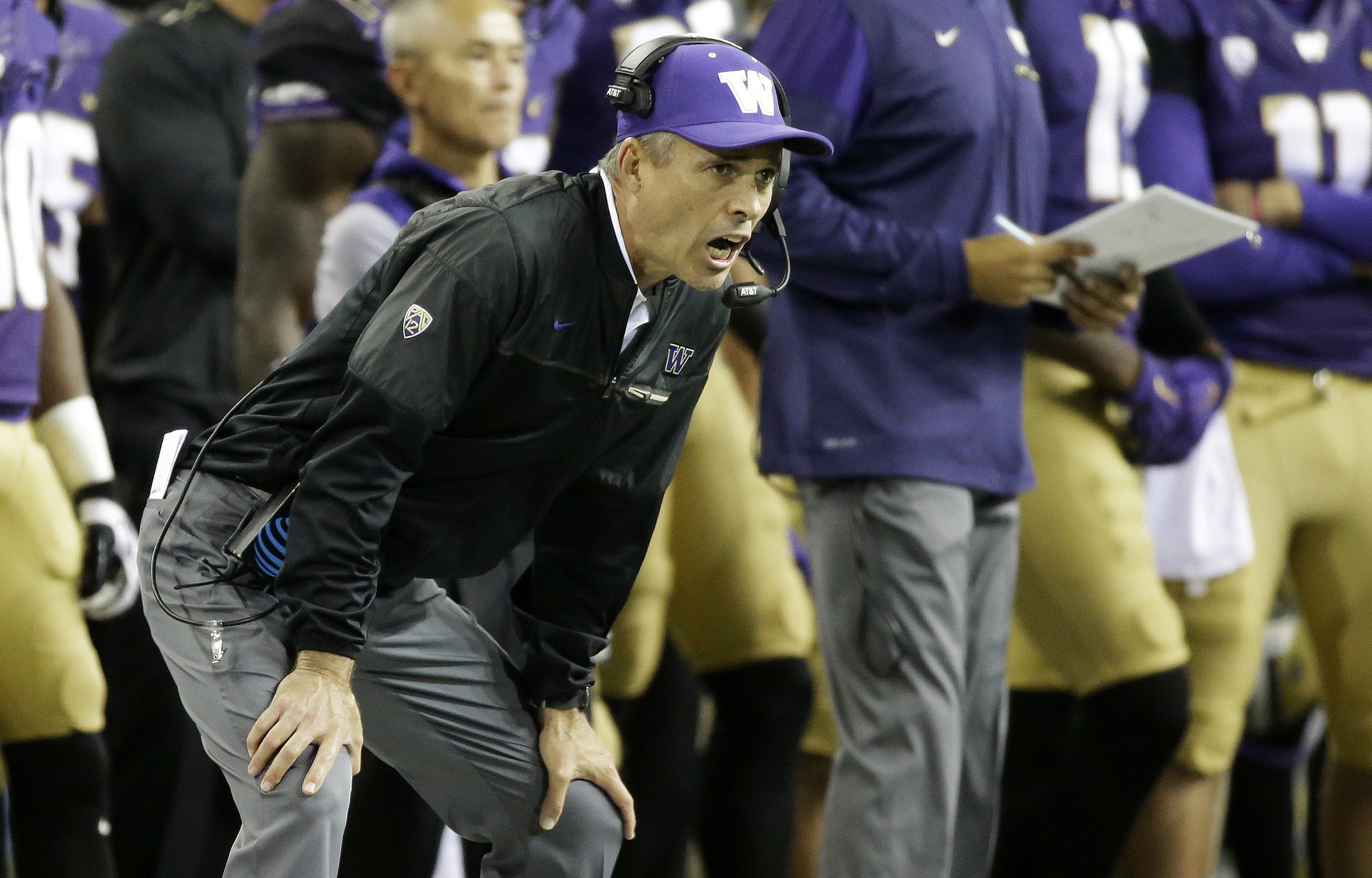 Washington coach Chris Petersen yells from the sideline during the second half of his team’s game against Stanford on Friday in Seattle. (Ted S. Warren/Associated Press)