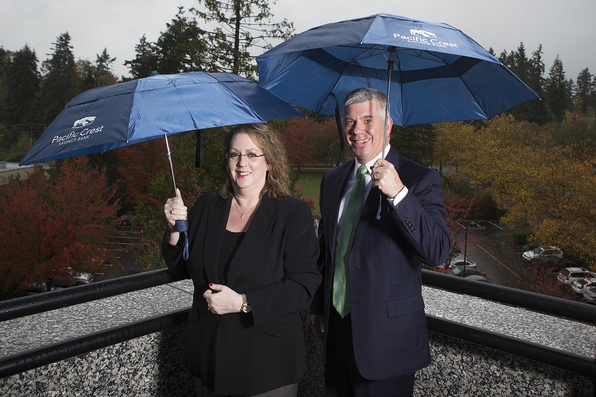 Sheryl Nilson, Pacific Crest Savings Bank CEO and President, and Wayne Bull, the bank’s CFO, stand outside of their fifth floor office in Lynnwood. The bank has no branches and instead provides customers with detail oriented online banking and service. (Ian Terry / The Herald)                                Sheryl Nilson, Pacific Crest Savings Bank CEO and President, and Wayne Bull, the bank’s CFO, stand outside of their fifth floor office in Lynnwood. The bank has no branches and instead provides customers with detail oriented online banking and service. (Ian Terry / The Herald)