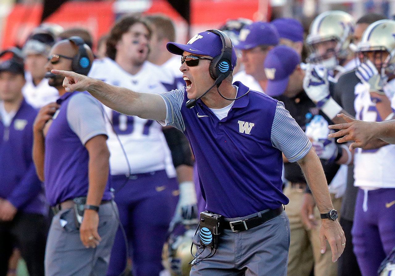 Washington head coach Chris Petersen shouts to his team in the second half of a game against Utah on Oct. 29 in Salt Lake City. Washington won 31-24. (AP Photo/Rick Bowmer)