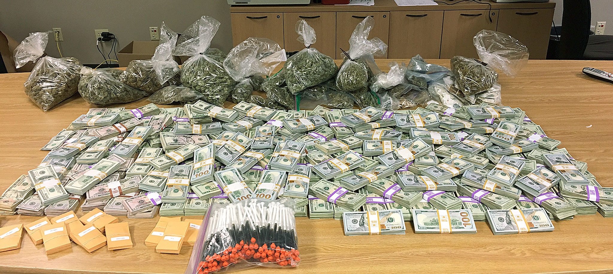 Large amounts of cash and marijuana were seized in Nov. 3 raids of an alleged organized crime ring. The investigation, based in King County, focused in part on multiple locations within Snohomish County, including a warehouse in Marysville. (King County Sheriff’s Office)