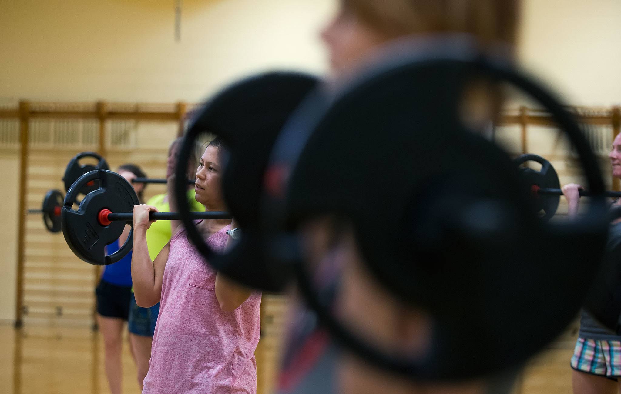 Dawn Skinner watches as instructor Gael Gebow shows how to lift correctly during a YMCA “Strength Train Together” exercise class Nov. 14, 2016 in Everett. The class is an example of the type of class that will be offered during the Thanksgiving “Burn the Bird” free exercise program. (Andy Bronson / The Herald)