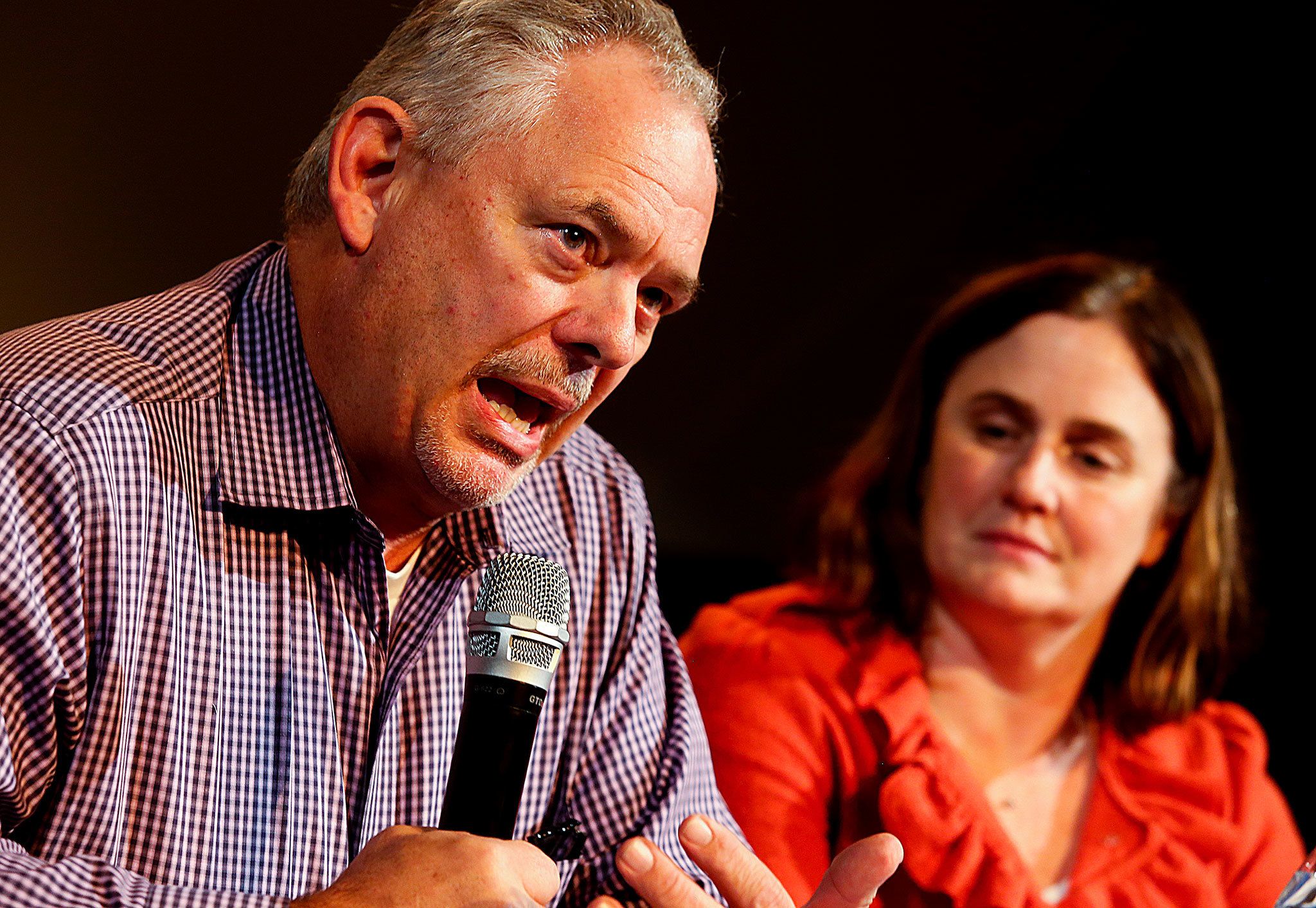 Jim Sporleder, former principal at Walla Walla’s Lincoln High School, shows strong emotion while describing how engaging with troubled kids rather than expelling them led to a dramatic turnaround at the school. Everett’s Sequoia High School Principal Kelly Shepherd (right) and others joined Sporleder in a panel discussion Tuesday night at the Historic Everett Theatre. The documentary “Paper Tigers,” filmed at Lincoln High School, was shown as part of the program. (Dan Bates / The Herald)