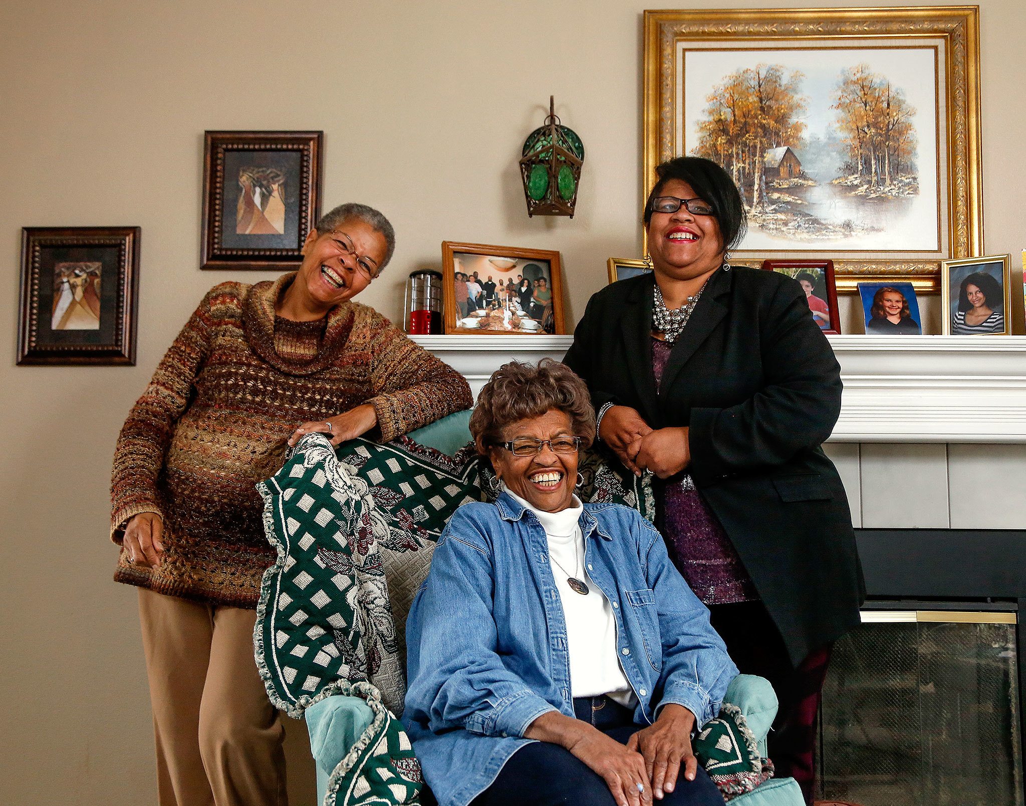 In this photo from last May, sisters, Georgina “Genie” Paul, 69, left, Marilyn Quincy, 72 and Mary Barrett, 55 share a lighter moment during an interview and photo shoot May 19. (Dan Bates / The Herald)