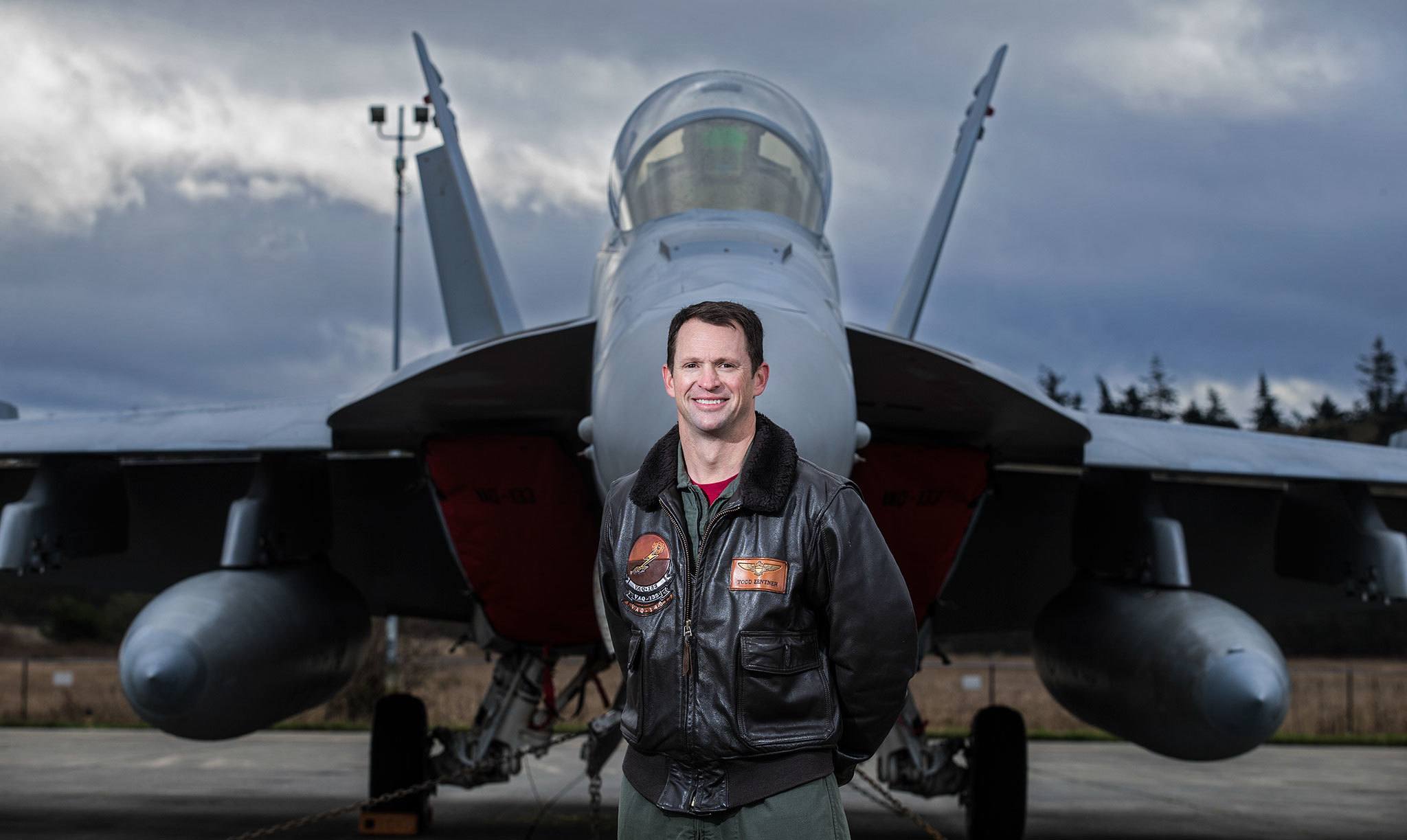 Cascade High School graduate Commander Todd Zentner stands in front of an EA-18G “Growler” at Whidbey Island Naval Air Station on Wednesday. Zentner graduated from Cascade in 1993, attended the Naval Academy and now serves as the Commander of the VAQ-133 Squadron known as the Wizards. (Andy Bronson / The Herald)