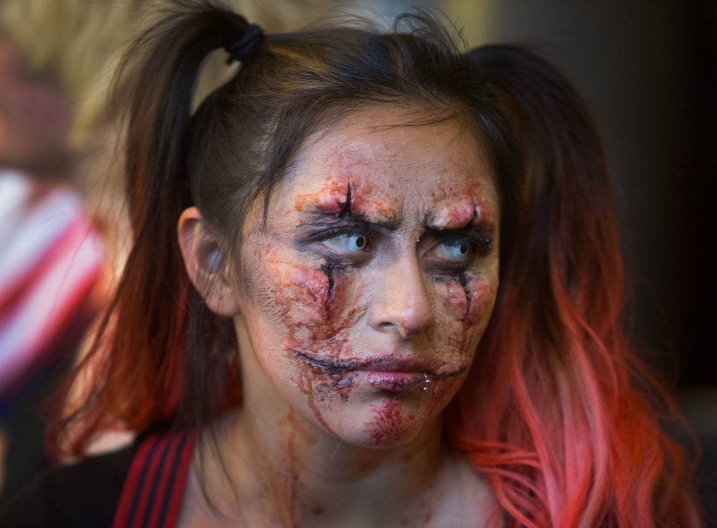 Angeles Roman sports a scary clown costume as students and faculty compete in the Hallo-Scream Contest at Everett Community College on Monday. (Andy Bronson / The Herald)
