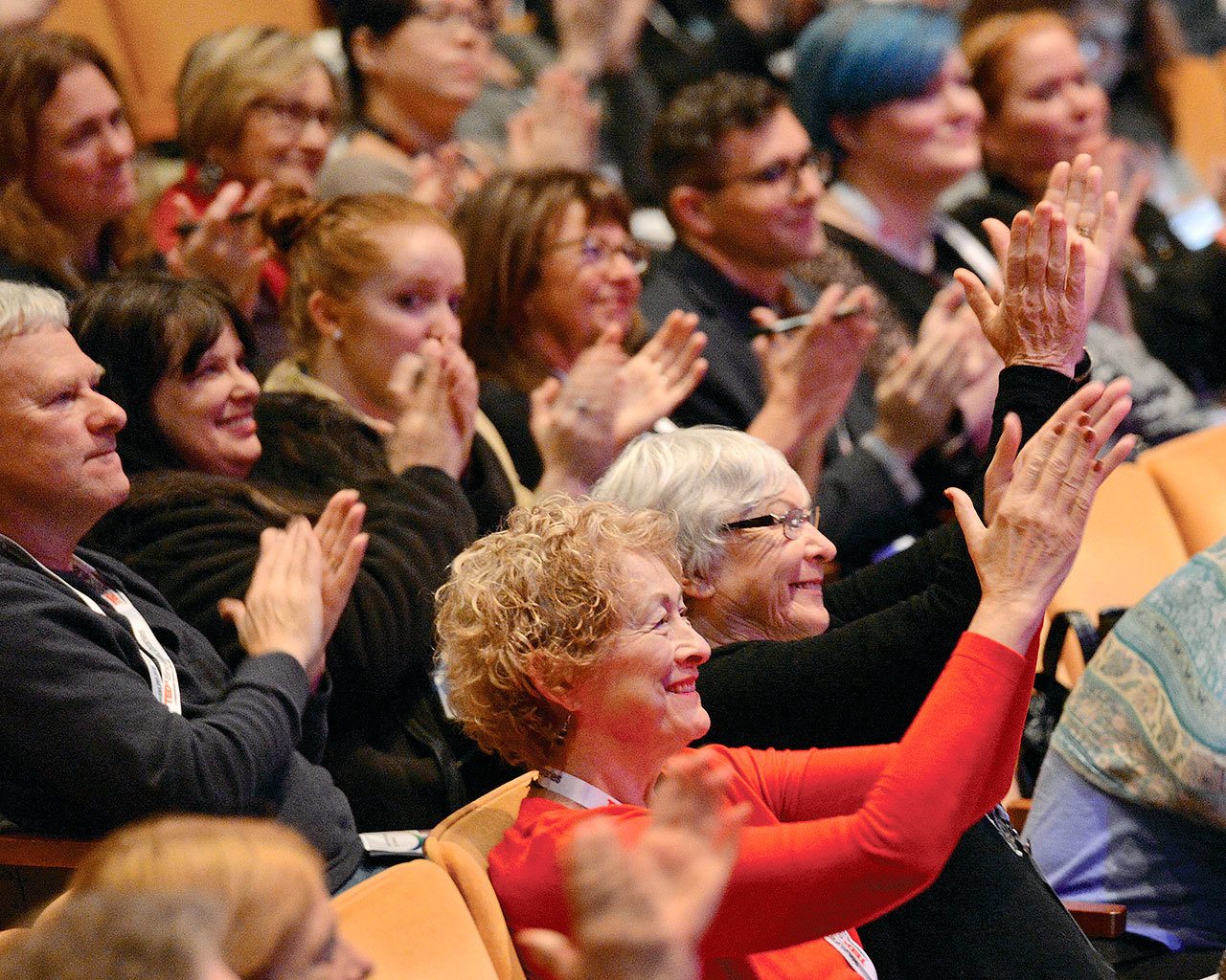 The TEDxSnoIsleLibraries audience applauds author Dawn Shaw, who spoke about how her facial difference affects her life and perspective. (Photo by Merlin Quiggle for Sno-Isle Libraries)