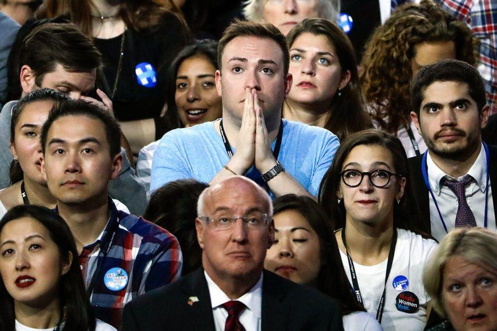 Guests at Democratic presidential nominee Hillary Clinton’s election night rally watch the big screen television at the Jacob Javits Center glass enclosed lobby in New York, on Tuesday, Nov. 8. (AP Photo/Matt Rourke)
