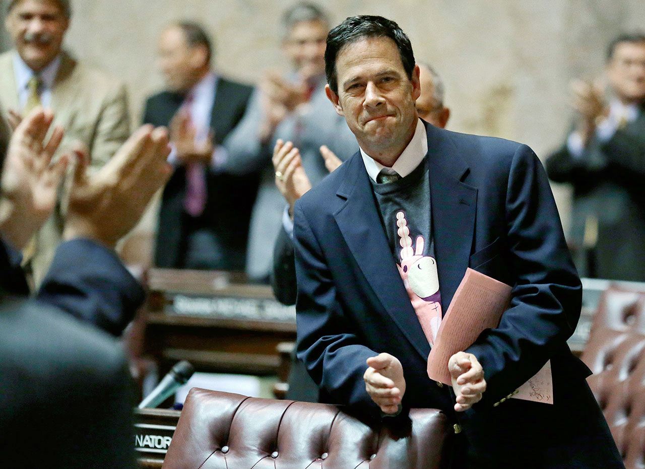 In this June 30, 2015, photo, Sen. Andy Hill, R-Redmond, the Senate’s chief budget writer, applauds staff members on the Senate floor after the Senate passed the $3.9 billion state construction budget during a late-night session at the Capitol in Olympia. Hill, who was 54, died Monday, Oct. 31, of lung cancer. (AP Photo/Ted S. Warren, File)