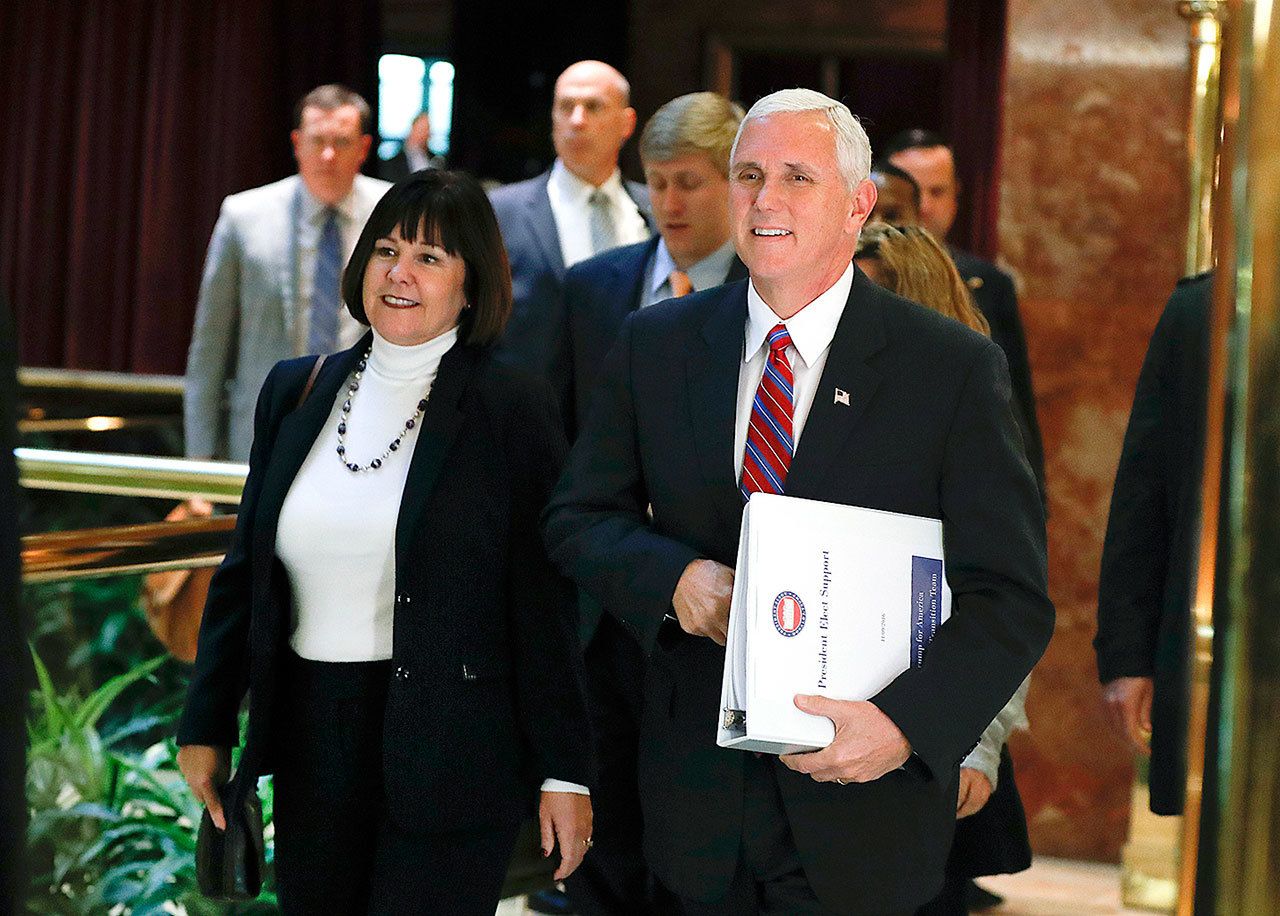 Vice President-elect Mike Pence and his wife, Karen, arrive at Trump Tower on Tuesday, Nov. 15, in New York. (AP Photo/Carolyn Kaster)