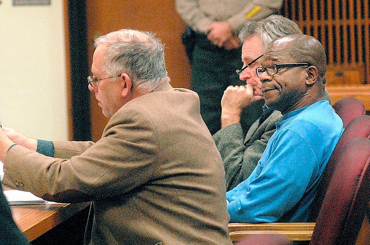 Tommy Ross Jr. (right) sits with attorneys Harry Gasnick (left) and John Hayden during Ross’ first appearance in Clallam County Superior Court on Wednesday in connection with the 1978 murder of Janet Bowcutt. (Keith Thorpe / Peninsula Daily News)