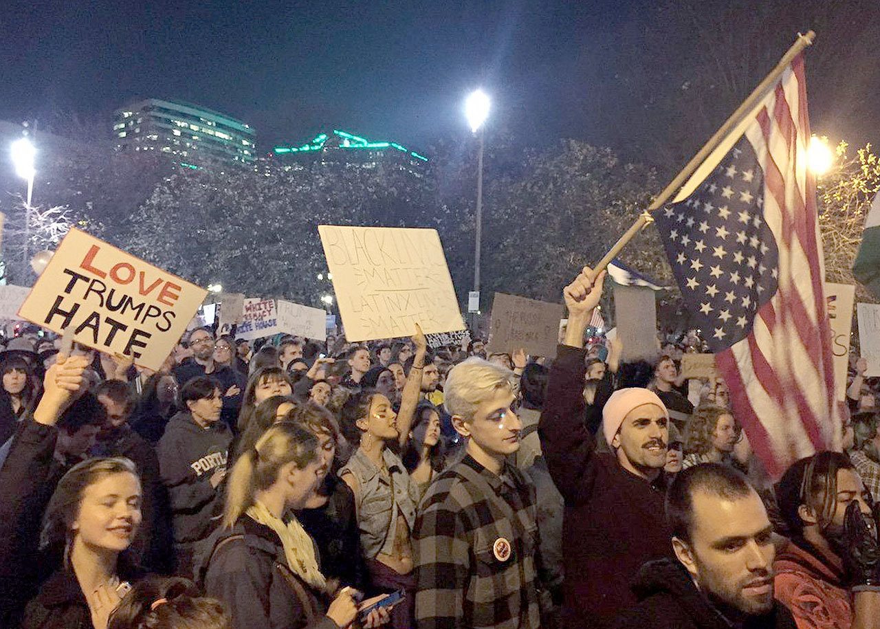 Protesters march to Waterfront Park in Portland on the third day of protests over the results of the 2016 U.S. presidential election on Thursday. (Jim Ryan/The Oregonian via AP)