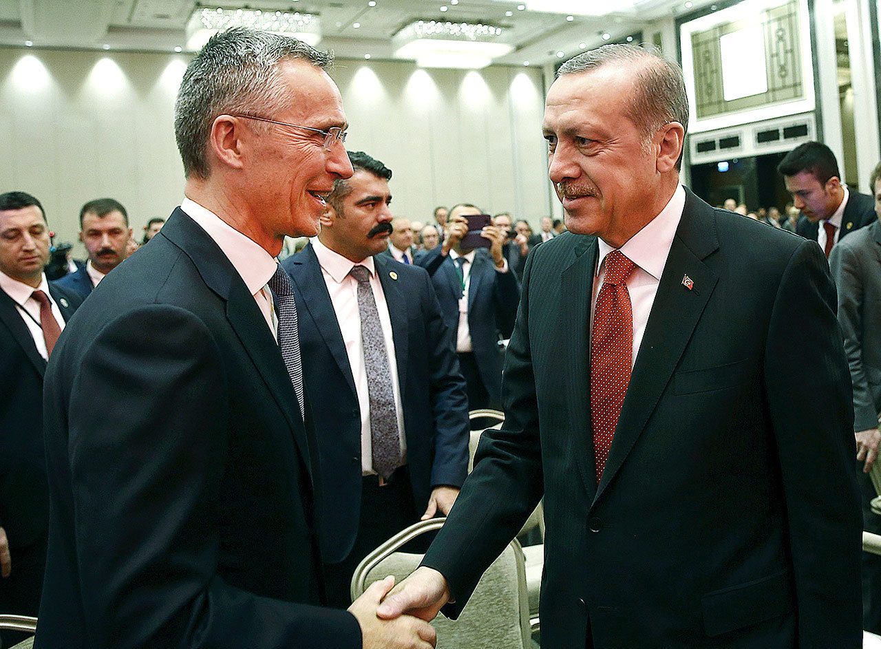 Turkey’s President Recep Tayyip Erdogan (right) and NATO Secretary General Jens Stoltenberg shake hands as they attend a NATO parliamentary assembly meeting in Istanbul on Monday, Nov. 21. Erdogan has called on the United States and other nations to re-assess his country’s proposal for the creation of a no-fly zone in northern Syria. (Kayhan Ozer, Presidential Press Service, Pool photo via AP)