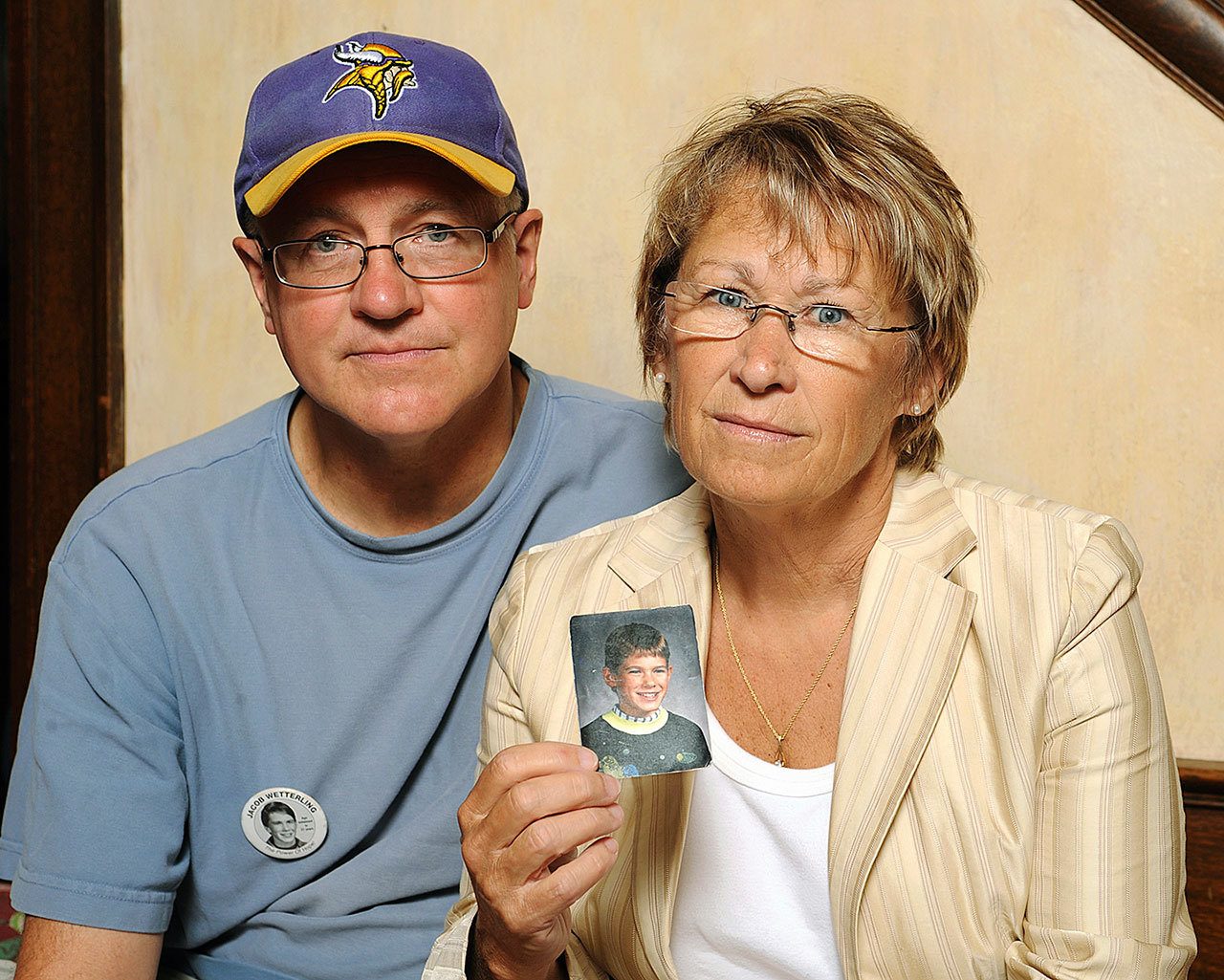 In this Aug. 28, 2009, photo, Patty and Jerry Wetterling show a photo of their son, Jacob Wetterling, who was abducted in October 1989 in St. Joseph, Minnesota. Daniel Heinrich, of Minnesota, who confessed to kidnapping, sexually assaulting and killing Jacob, has shed “countless tears” for Jacob and his family in the 27 years since his death, his lawyer said in a court filing Thursday, Nov. 17. (AP Photo/Craig Lassig, File)