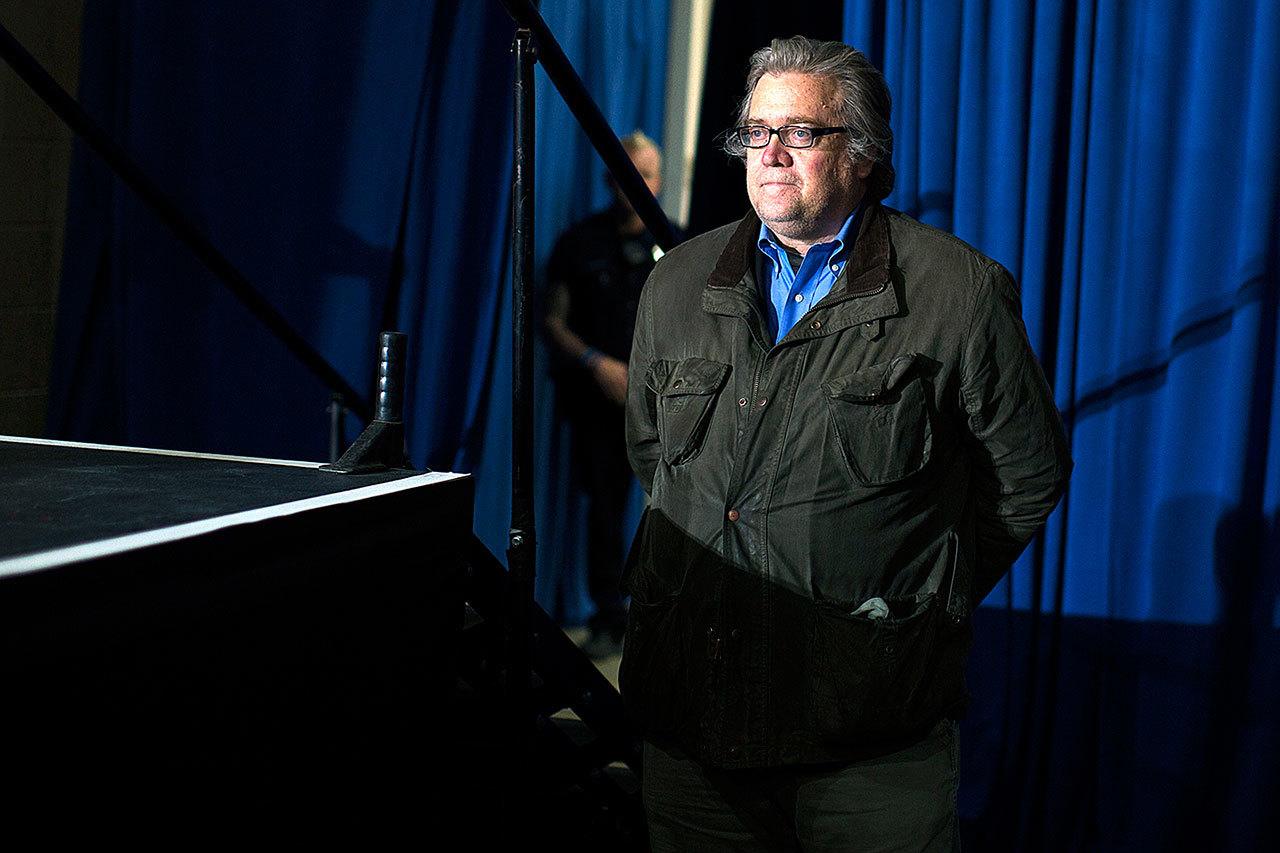 In this Nov. 5 photo, Stephen Bannon, campaign CEO for Republican presidential candidate Donald Trump, looks on as Trump speaks during a campaign rally in Denver. (AP Photo/Evan Vucci, File)