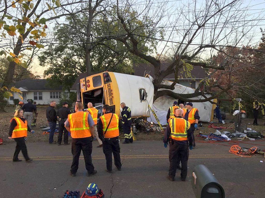 Chattanooga Fire Department personnel work at the scene of a fatal elementary school bus crash in Chattanooga, Tennessee, on Monday. (Bruce Garner/Chattanooga Fire Department via Chattanooga Times Free Press via AP) 
