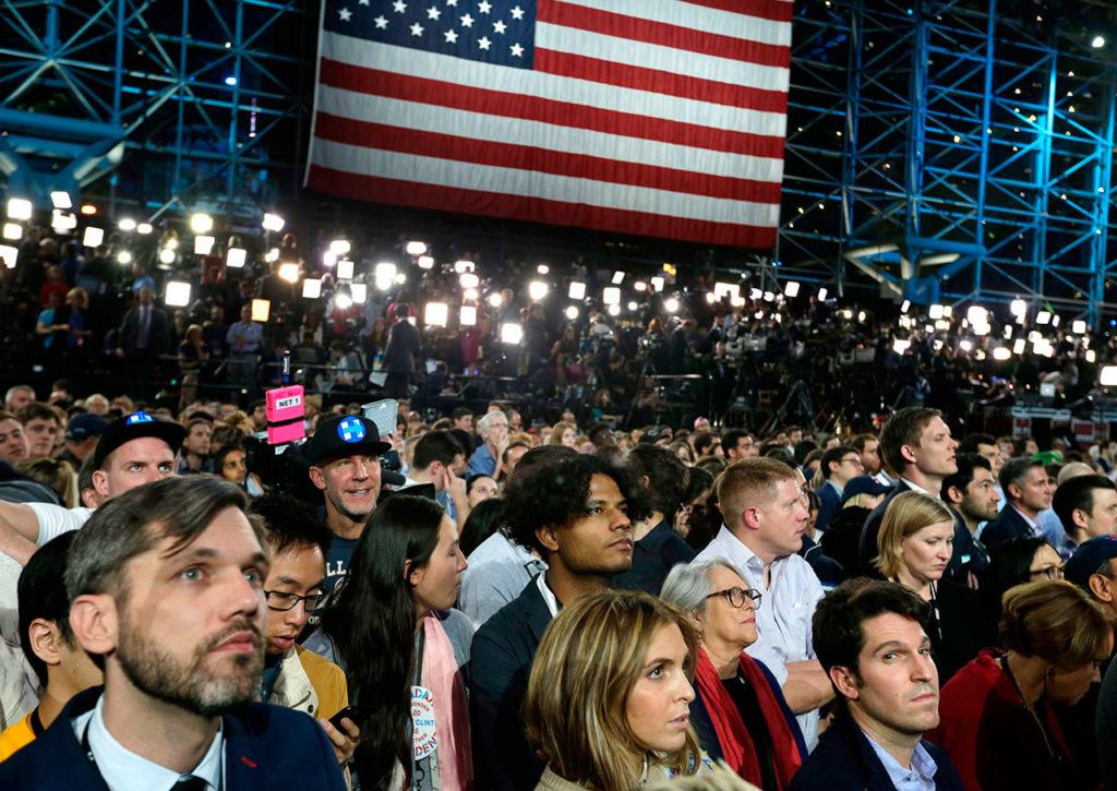 Supporters watch election results during Democratic presidential nominee Hillary Clinton’s election night rally in the Jacob Javits Center glass enclosed lobby in New York on Tuesday, Nov. 8. (AP Photo/Frank Franklin II)
