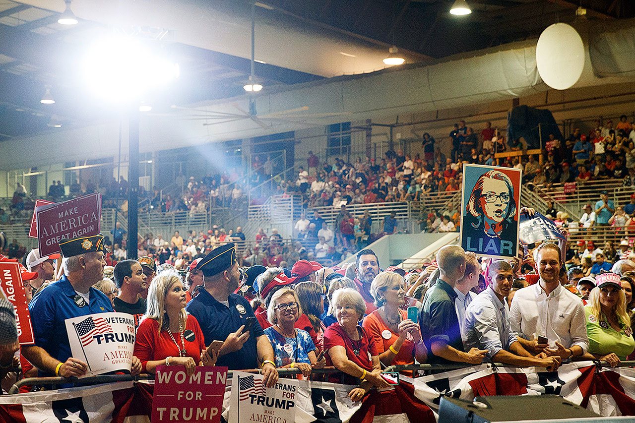 Supporters of Republican presidential candidate Donald Trump wait for his arrival to a campaign rally at the Jacksonville Equestrian Center, on Thursday, Nov. 3, in Jacksonville, Florida. (AP Photo/ Evan Vucci)