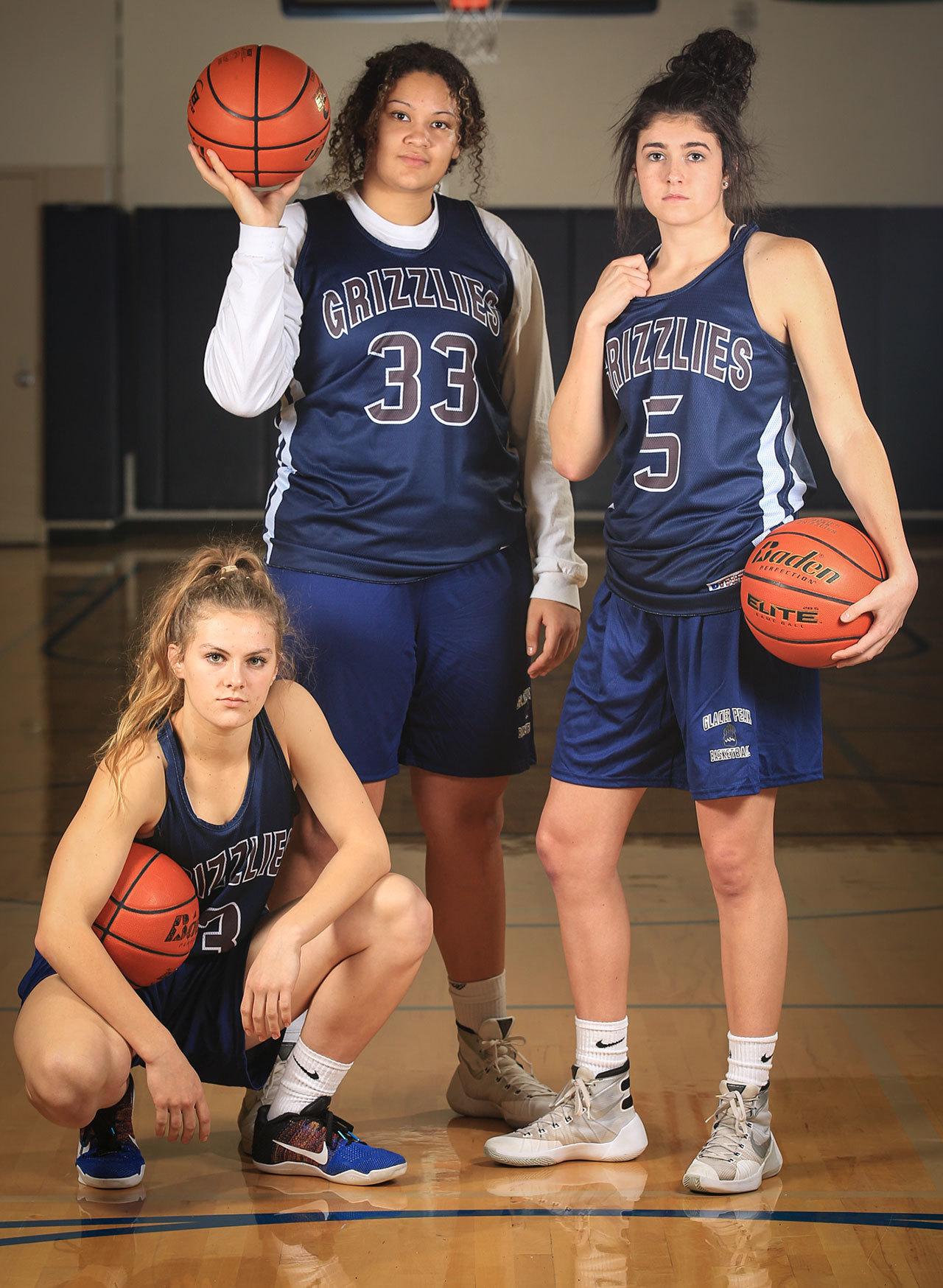 From left to right, Glacier Peak seniors and Division-1 recruits Paisley Johnson (Brigham Young), Kayla Watkins (Weber State) and Samantha Fatkin (Arizona). (Kevin Clark / The Herald)