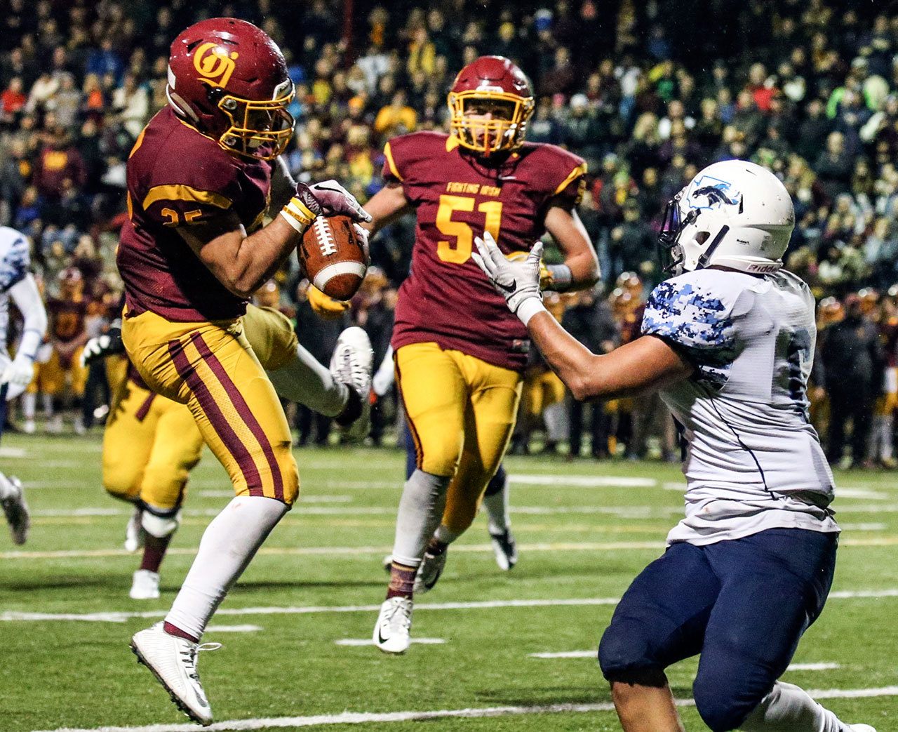 O’Dea’s Hunter Franco (left) intercepts a pass in the end zone intended for Meadowdale’s Kela Marshall during a 3A state semifinal game Saturday at Pop Keeney Stadium in Bothell. O’Dea won 35-9. (Kevin Clark / The Herald)