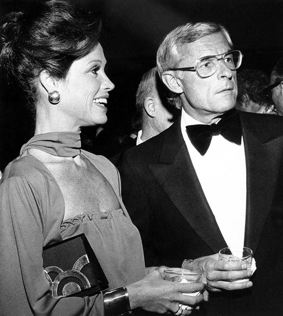 In this 1976, photo, Mary Tyler Moore attends a reception in Los Angeles with her husband, Grant Tinker, before she was honored by the Hollywood chapter of the National Academy of Television Arts and Sciences for outstanding achievement in the industry. (AP Photo/File)

