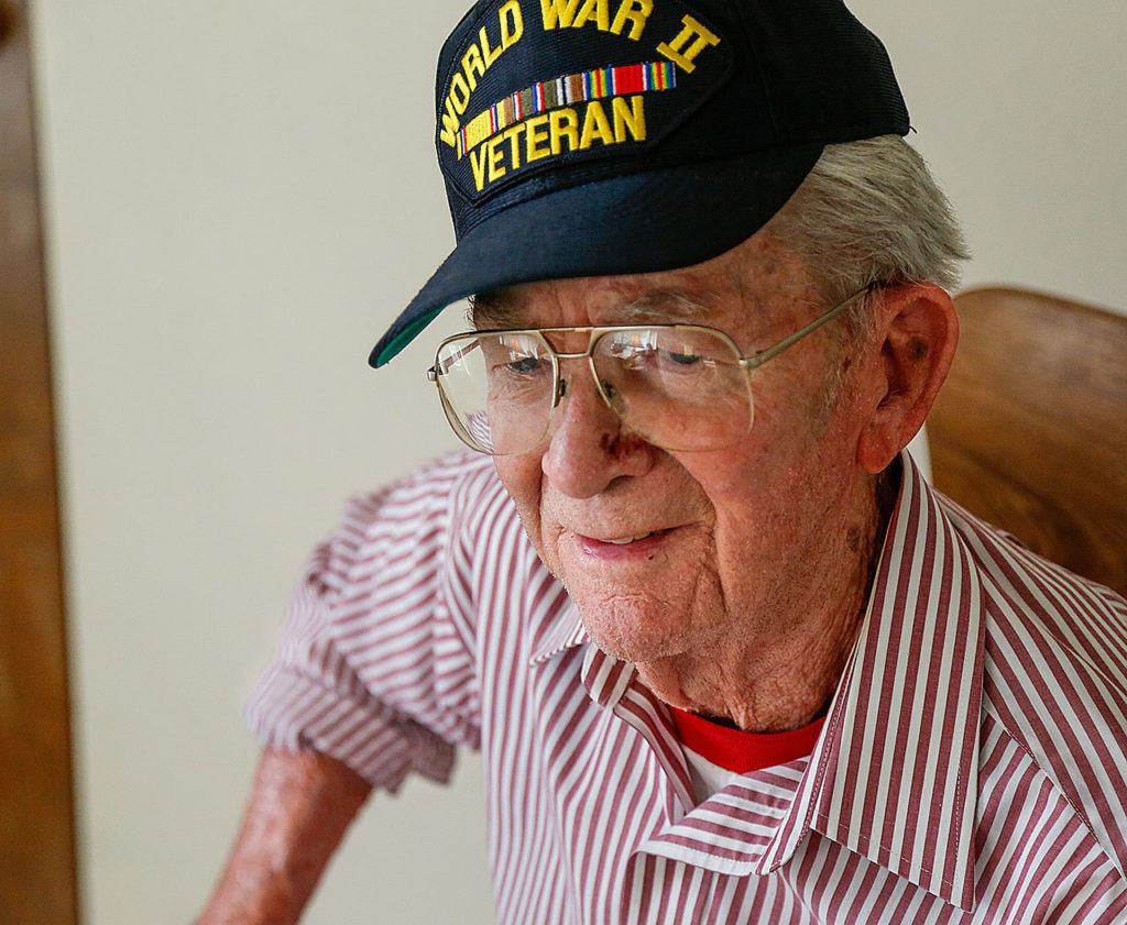Raymond Lund, 95, is a World War II veteran who served in Europe, including the beach landing at Normandy. (Dan Bates / The Herald)
