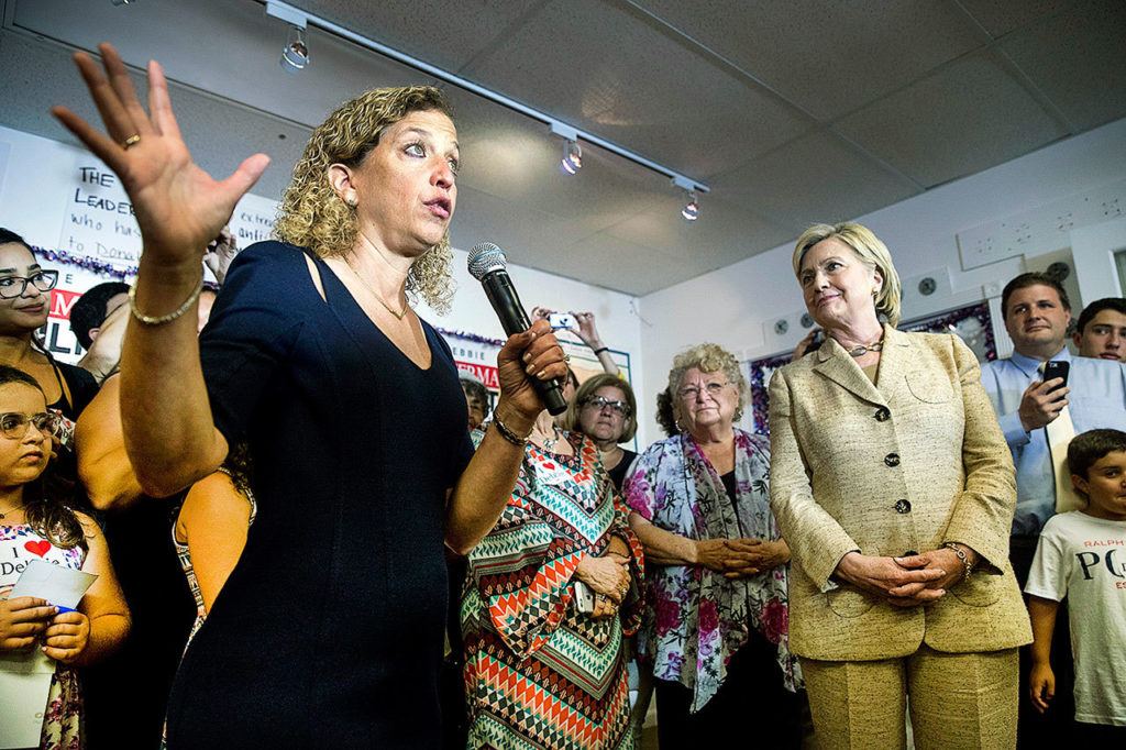 In this Aug. 9, 2016, photo, Rep. Debbie Wasserman Schultz, D-Fla. introduces Democratic presidential candidate Hillary Clinton as she stops in to greet workers at a campaign office for Wasserman Schultz, in Davie, Florida. (AP Photo/Andrew Harnik)
