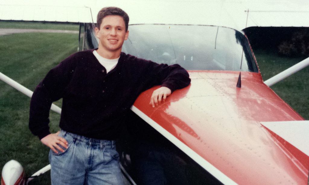 Todd Zentner stands by a Cessna airplane at Harvey Field in Snohoimish, where he earned a pilot’s license in the summer between his junior and senior years at Cascade High School. (Zentner family) 
