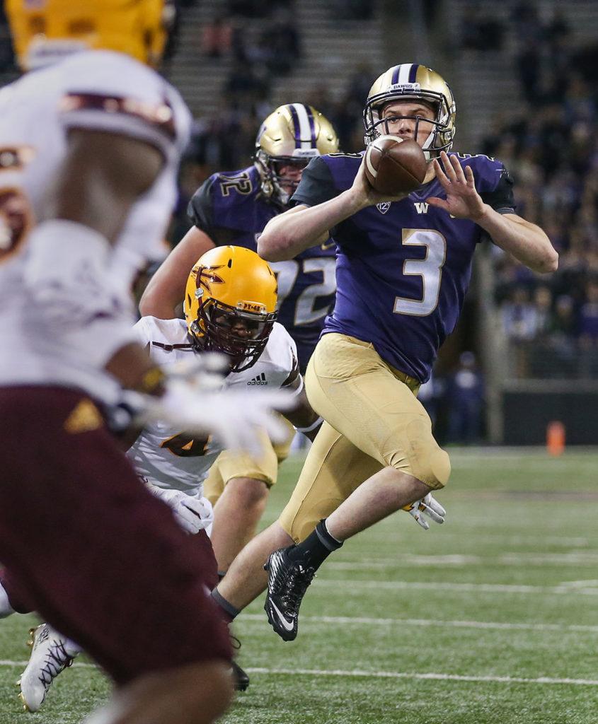 Washington quarterback Jake Browning attempts a pitch into the end zone against Arizona State on Saturday at Husky Stadium in Seattle. (Kevin Clark / The Herald)

