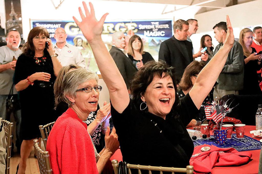 Republician supporters react to the numbers coming in at the Snohomish Event Center on Tuesday, Nov. 8. (Kevin Clark / The Herald)
