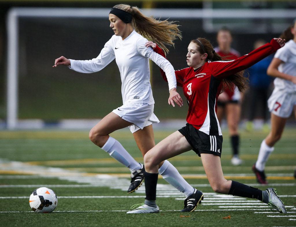 Snohomish’s Mackenzie Green (right) tries to stop a charging Anna DePew of Stanwood during a district playoff game Tuesday at Shoreline Stadium. (Ian Terry / The Herald)
