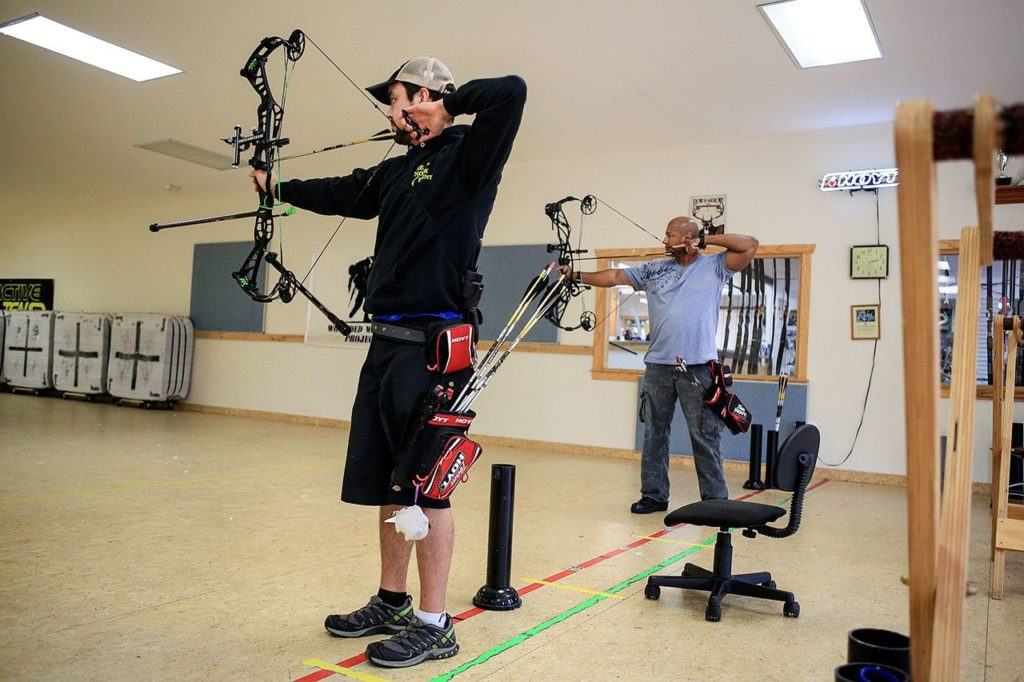 Mike Hooper, Nock Point employee and instructor, left, and Vincent Hancock practice at Nook Point Center in Mountlake Terrace on October 12, 2016. (Kevin Clark / The Herald)
