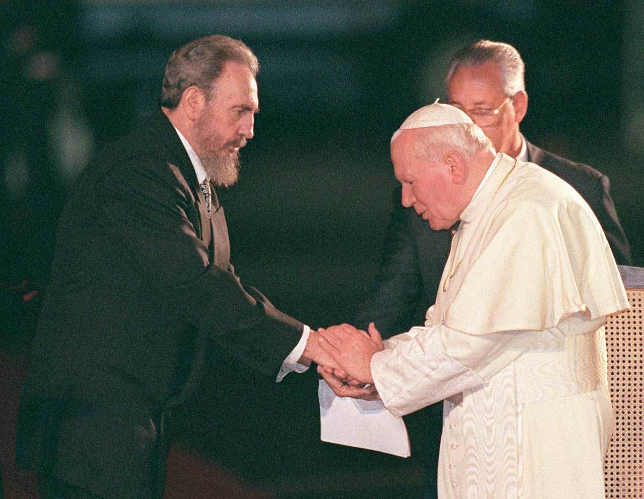 Jan. 25, 1998: Fidel Castro greets former Pope John Paul II at the Jose Marti International Airport in Havana. (AP Photo/Ruth Fremson, File)

