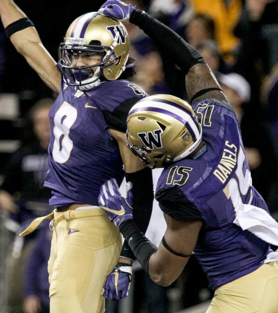 Washington wide receiver Dante Pettis (left) and Washington tight end Darrell Daniels celebrate Pettis’ touchdown against Arizona State on Saturday at Husky Stadium in Seattle. (Kevin Clark / The Herald)

