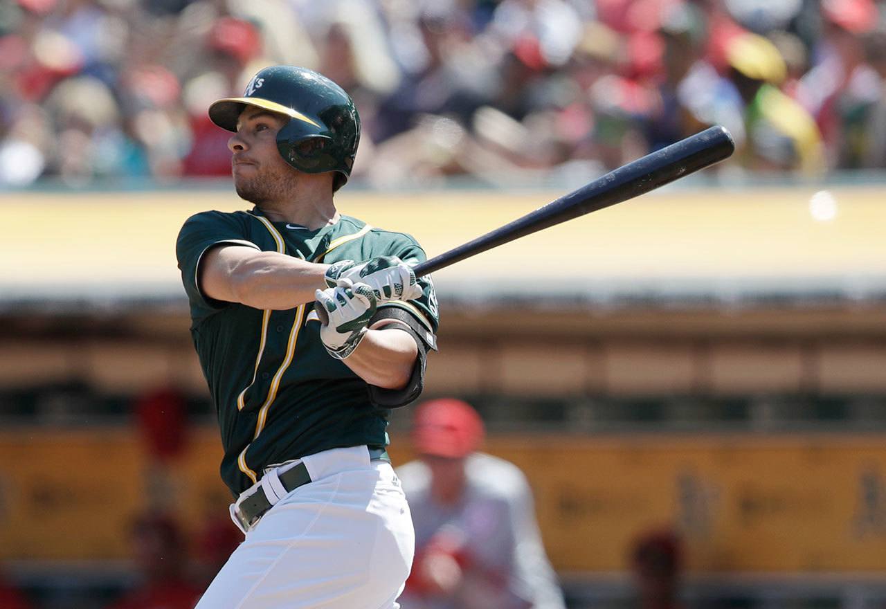 Oakland Athletics’ Danny Valencia watches his two-run home run against the Los Angeles Angels during the first inning of a game on Sept. 5 in Oakland, California. (AP Photo / Marcio Jose Sanchez)