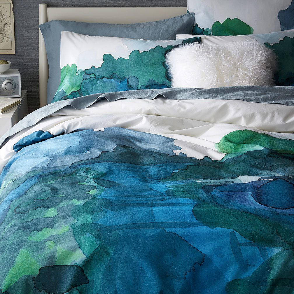 Roar+ Rabbit’s Organic Landscape duvet cover and shams ($29-$109, westelm.com) feature deep colors done in a painterly way. (West Elm)
