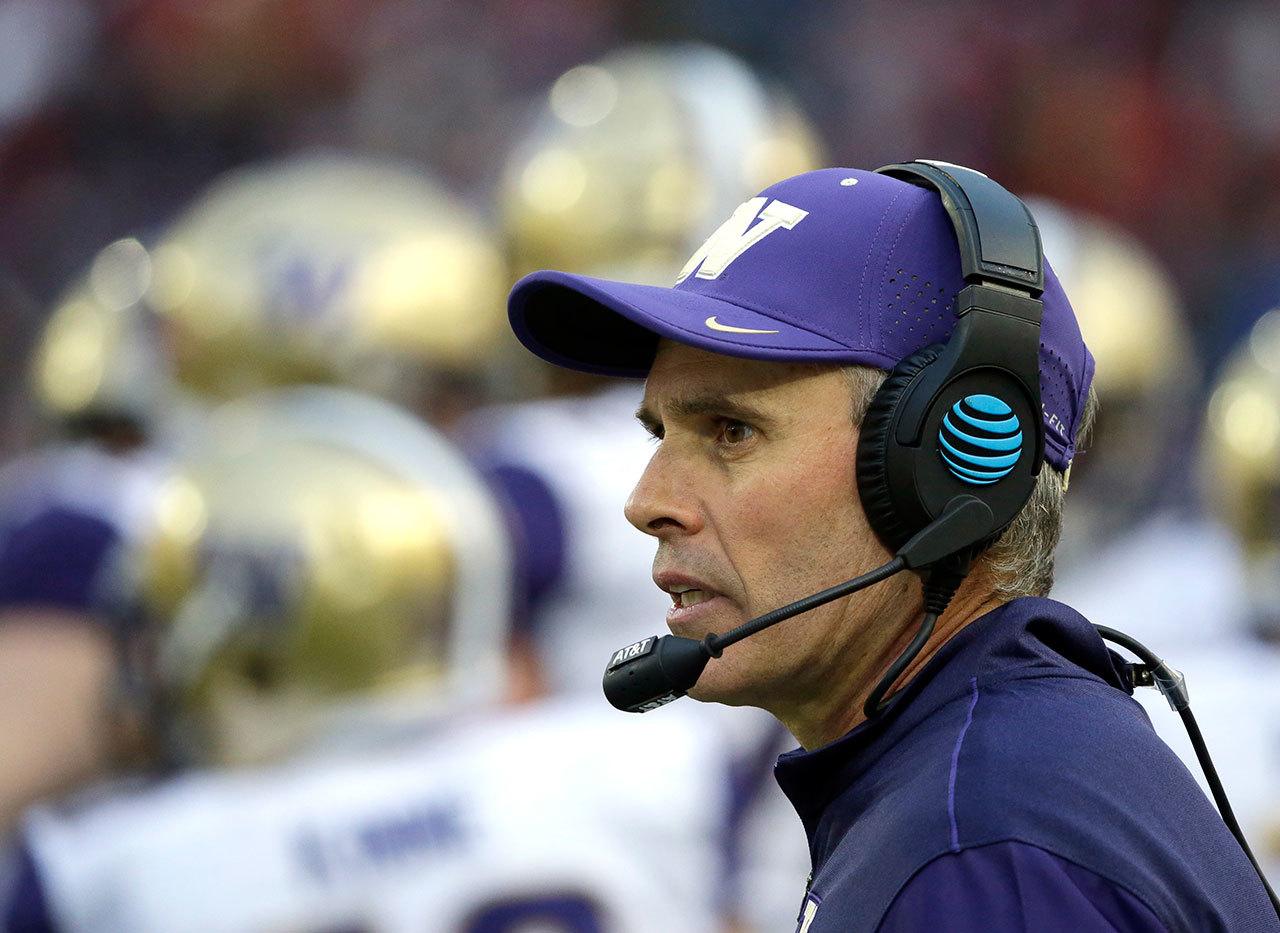 Washington head coach Chris Petersen watches from the sideline in the second half of the Apple Cup against Washington State on Nov. 25 in Pullman. Washington beat Washington State 45-17. (AP Photo/Ted S. Warren)